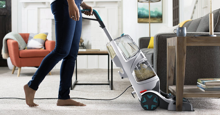 A carpet cleaner removes spills and stains