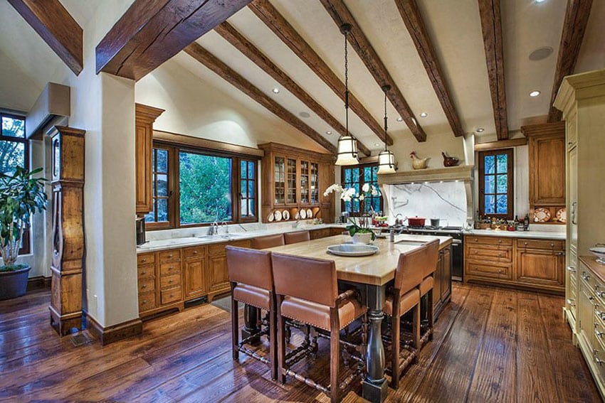 Country kitchen with raised panel cabinets and center dining island
