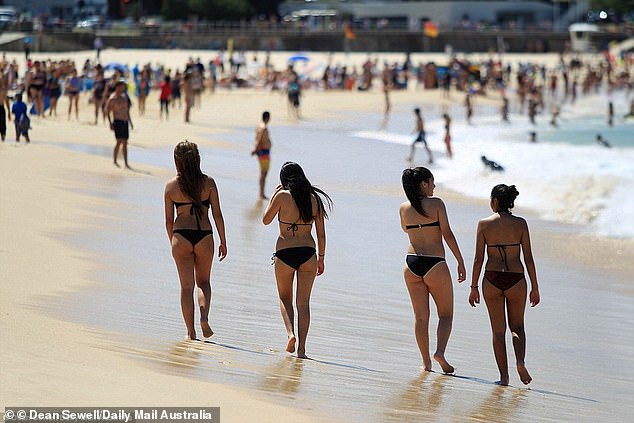 Northwest NSW will see temperatures up to 30 degrees (women pictured a Sydney beach)