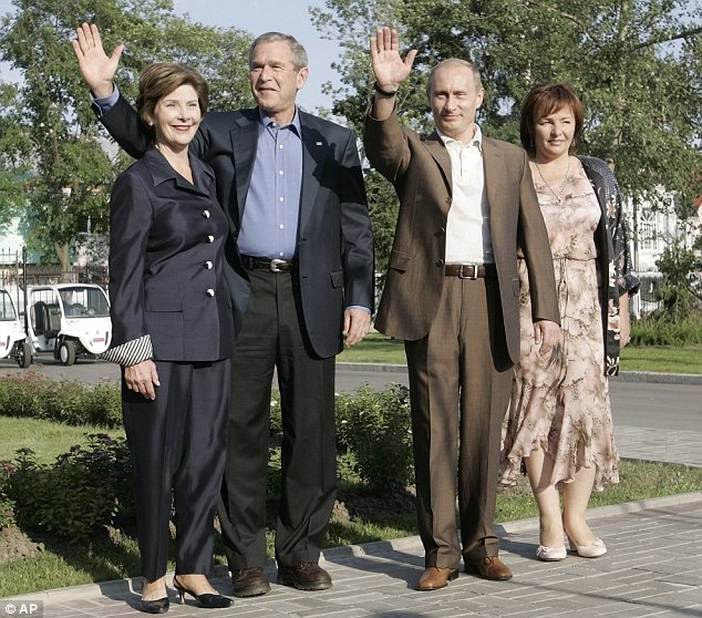 Days gone by: Putin was often pictured with his wife, as seen here with U.S. President George W Bush and wife Laura in 2006, but Lyudmila has shied away from public view in recent years