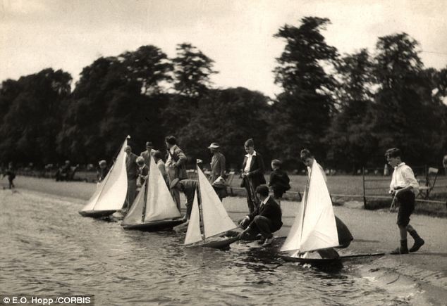 Another tricky customer: Boys sailing toy boats in Kensington Gardens in the Thirties. Say 