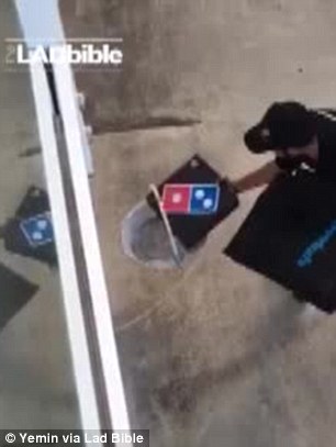 Video shows a deliveryman place a pizza order in the basket of a pulley system as the customers hoist it to their balcony above