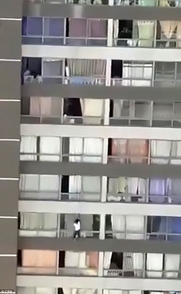 The woman was heard saying things as she hung outside the ninth-floor balcony in Chile, pictured