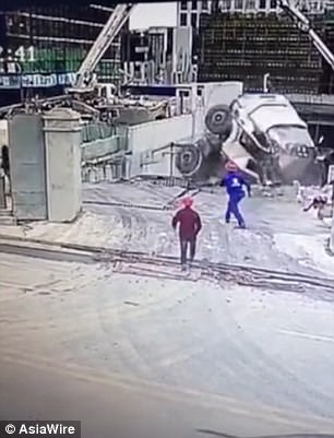 He plunges along with the mixer some 23ft down at the construction site