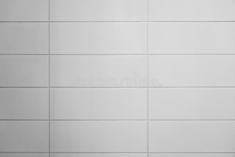 Seamless white bathroom wall tiles. Pattern, brick texture for background royalty free stock images