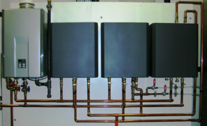 Modern factory assembled hydronic control appliances for underfloor heating and cooling, shown with covers on 
