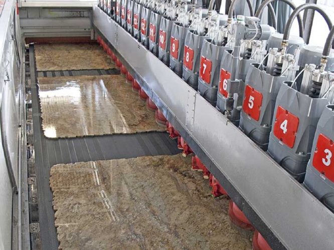 Slabs of granite polished on large polishing lines (picture shown is a Breton machine)