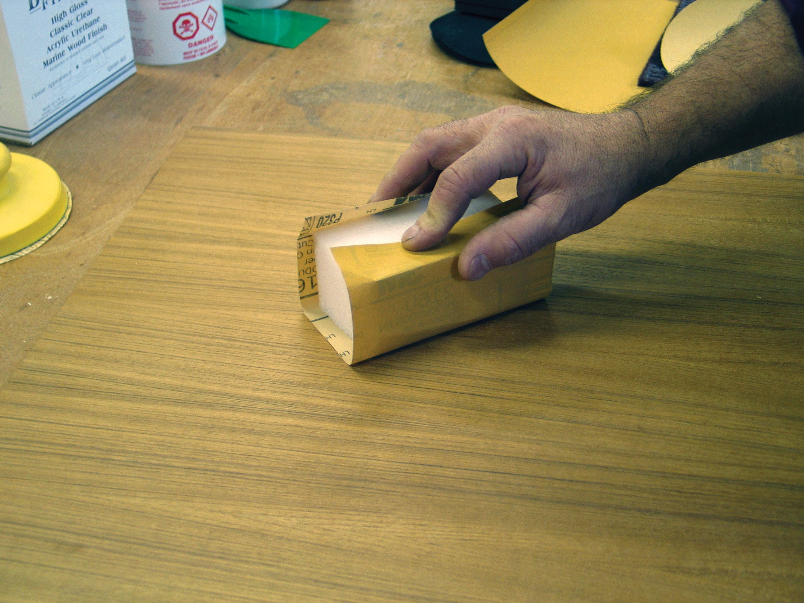 Photo of sanding the wood surface