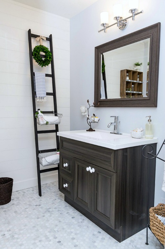 Farmhouse style bathroom with wooden storage ladder.
