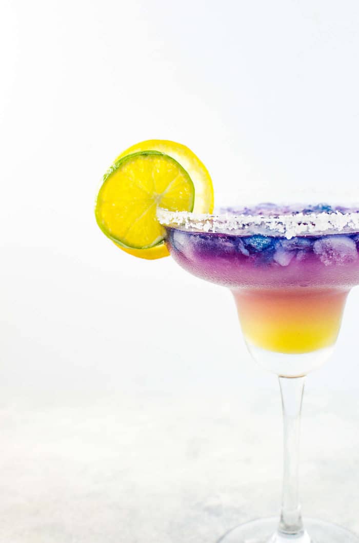 Magical Color Changing Cocktail - A Color changing Margarita that reminds you of the sunset! Tastes amazing and look magical and made with Blue Pea Tequila